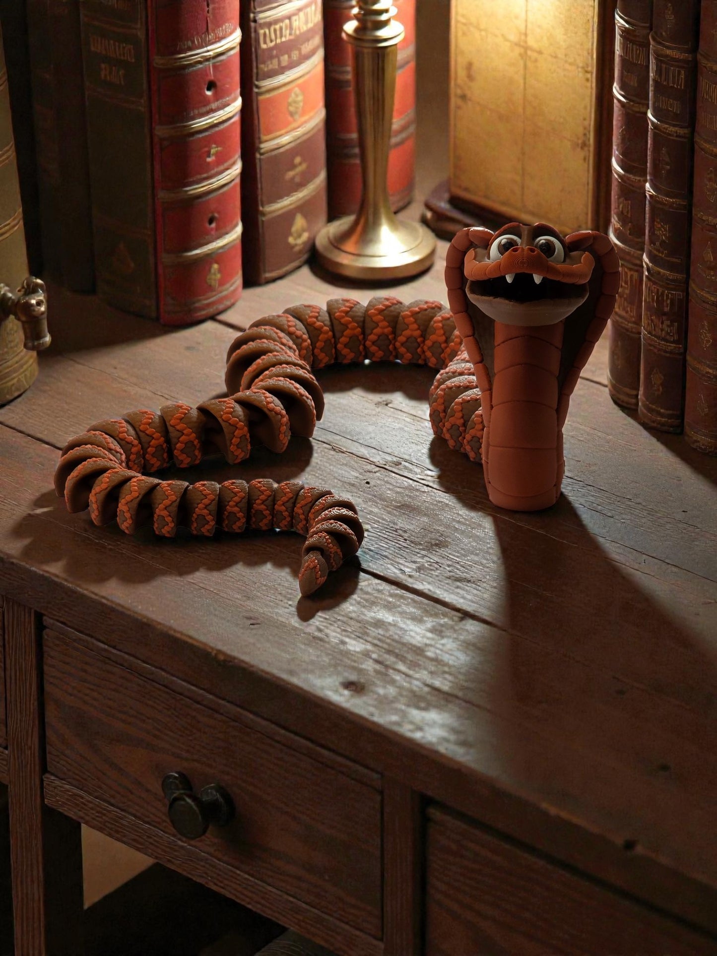 Close-up of segmented poseable joints on 3D printed king cobra showing flexible articulation